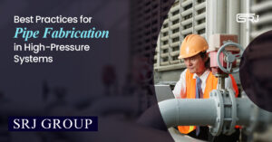 Engineer inspecting high-pressure piping system with safety gear during pipe fabrication project.