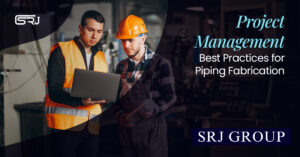 Two male industrial workers, one in a high-visibility vest holding a laptop and the other in a hard hat and overalls, review information on the laptop in a factory setting. The text "Project Management Best Practices for Piping Fabrication" and "SRJ GROUP" is overlaid.